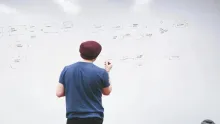person pondering whiteboard
